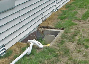 old concrete window well of a Douglas crawl space