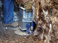 Securing a foundation footing bracket for a foundation repair system in Nogales.