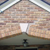 Major tuckpointing on a home archway over a door, with tuckpointing several inches wide that has failed on a Tucson home