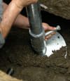 Green Valley helical pier installation nearing completion, with the blade being advanced into the foundation soils.